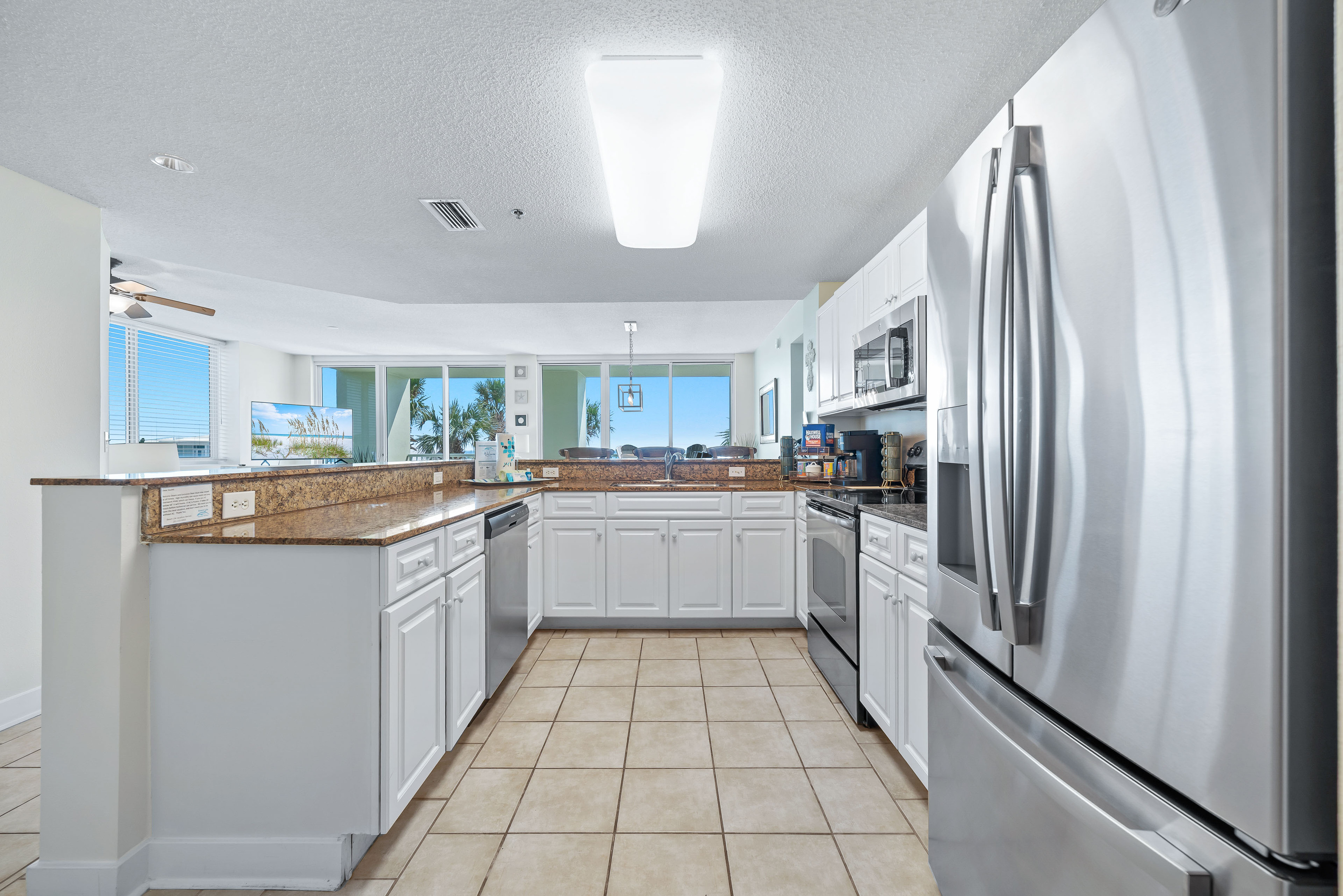 The granite countertops provide a durable and stylish workspace in this well-appointed kitchen.