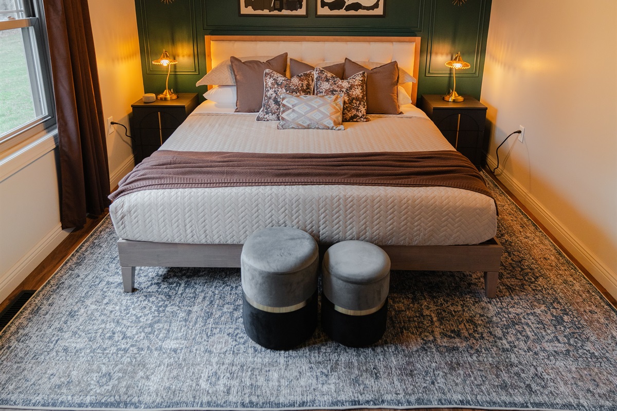 A spacious bedroom with a king bed and a comfortable setup for a good night’s sleep.