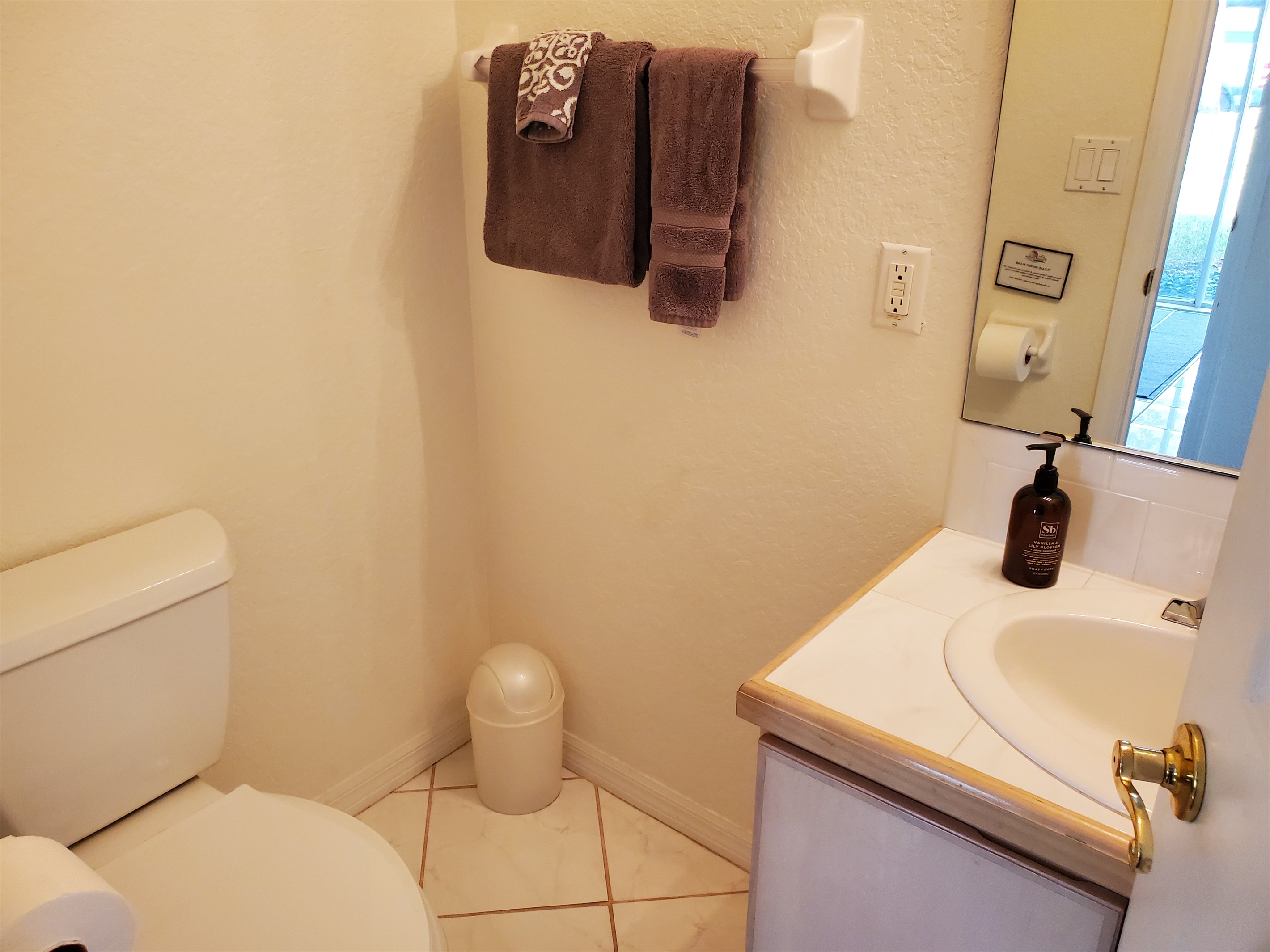 1/2 bath located near the Queen and Twin bedroom