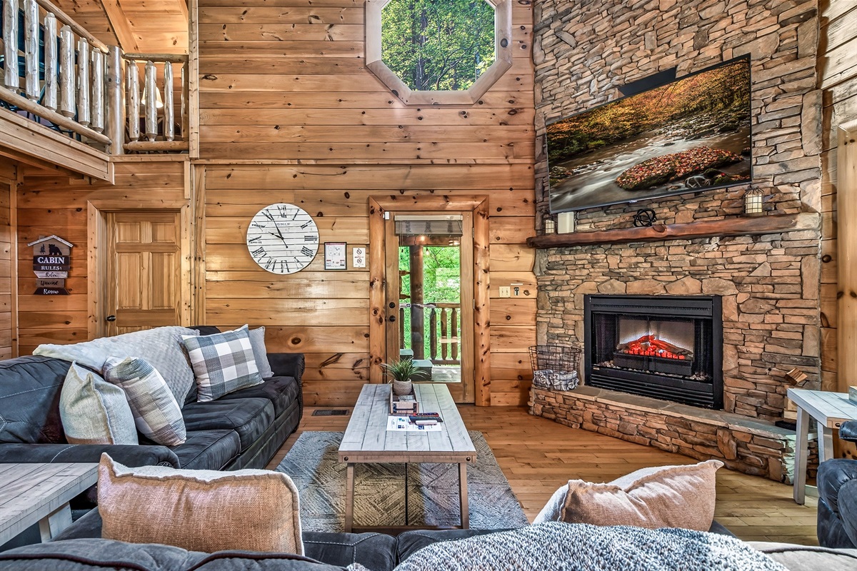 A selection of entertainment options including a 65" 4k Roku TV and Xfinity cable TV. Open the back door to step out into the relaxing hot tub.