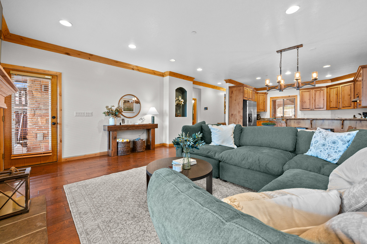 Inviting living space designed for gathering, with seamless flow into the kitchen and dining area