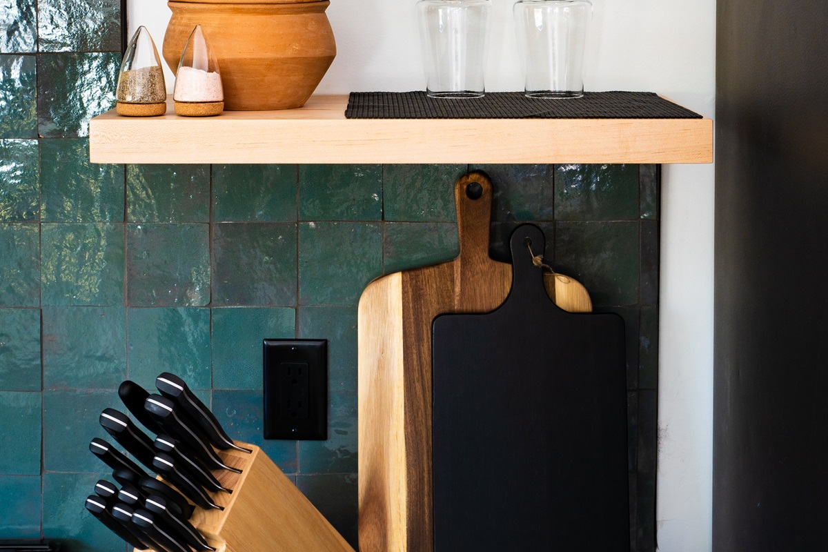 Charming kitchen details with natural wood accents, open shelving, and essentials for easy meal prep.