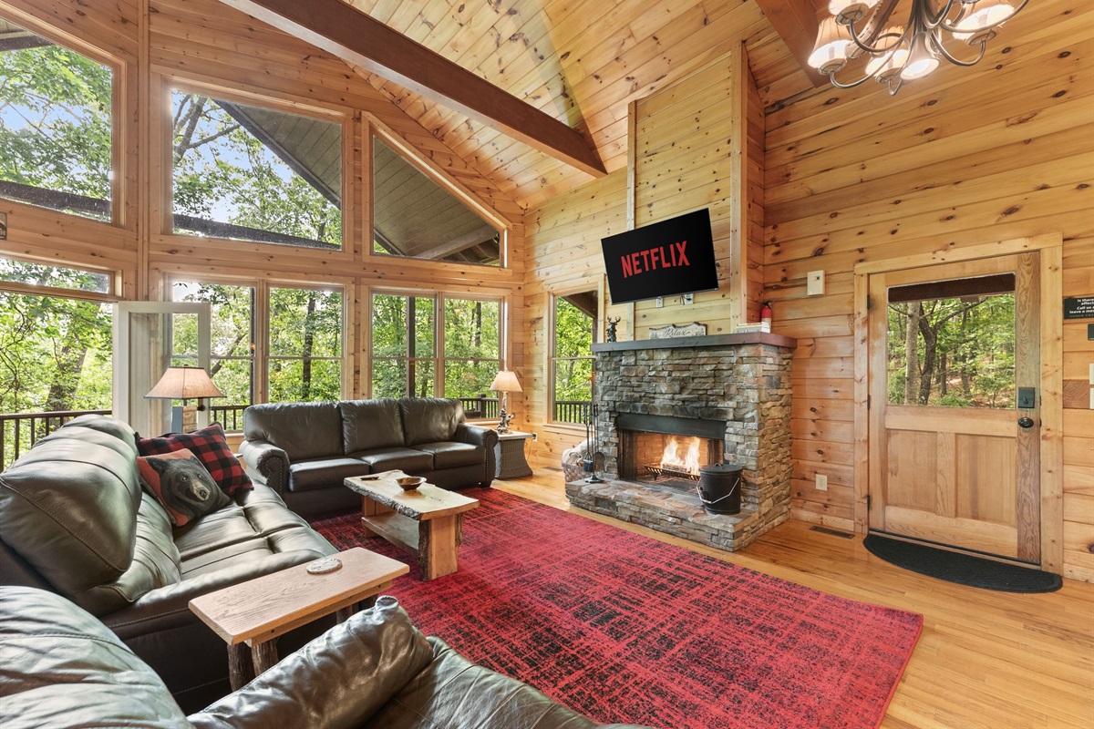 Rustic wood-burning fireplace creates the ultimate mountain cabin vibe.