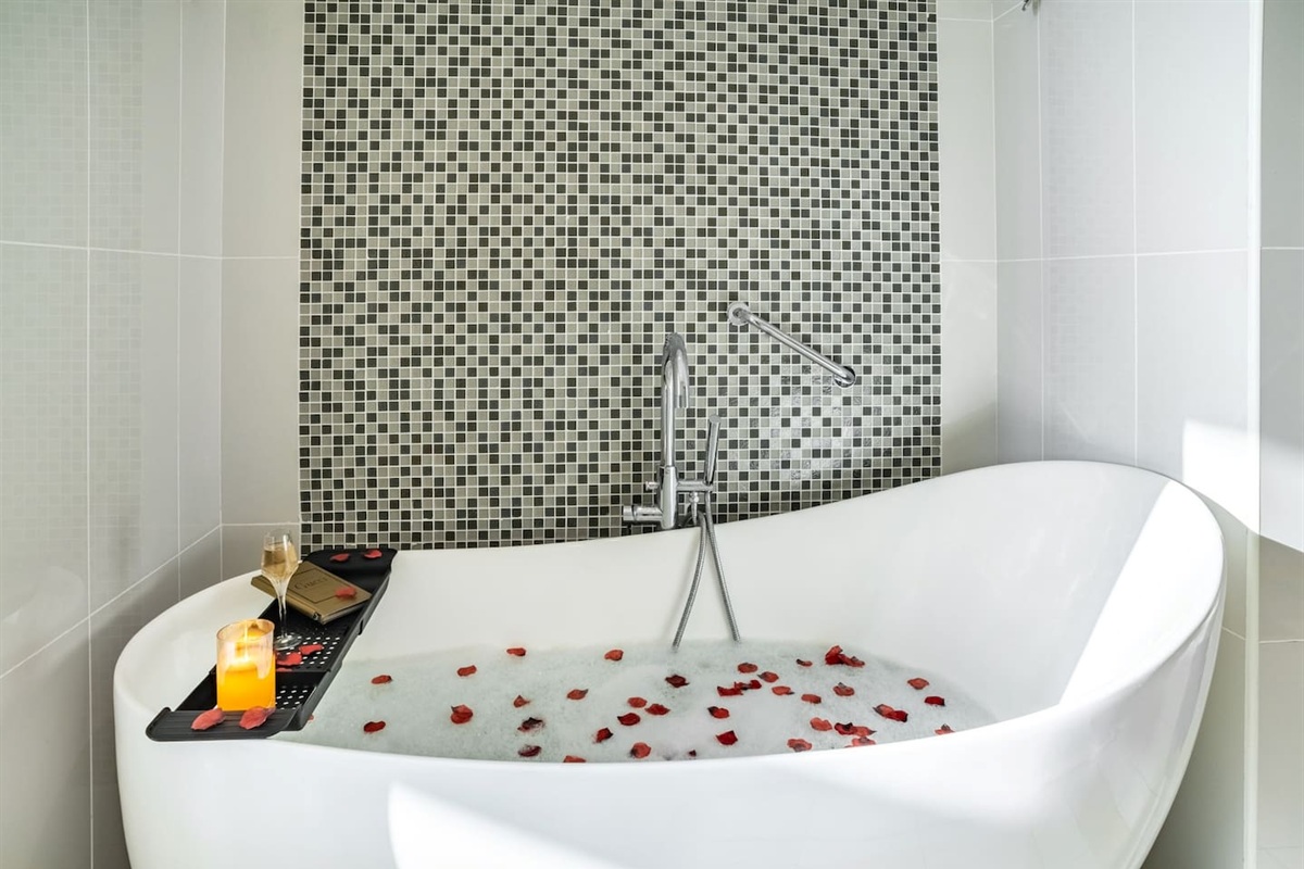 Large bathroom with bath-tube and shower