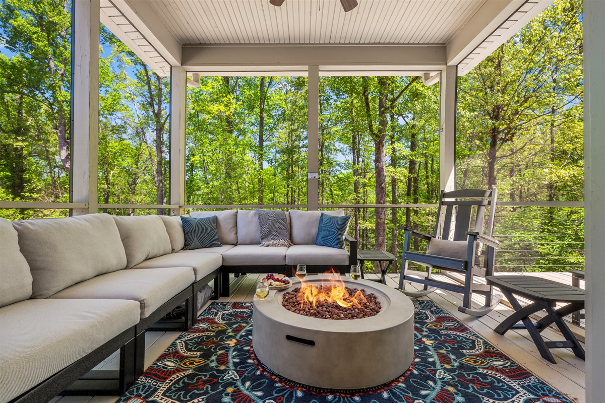 Start your mornings watching the sun rise over the mountains, glowing through the trees. This cozy screened-in porch with a modern fire pit and plush sectional is your front-row seat to Asheville’s natural beauty.