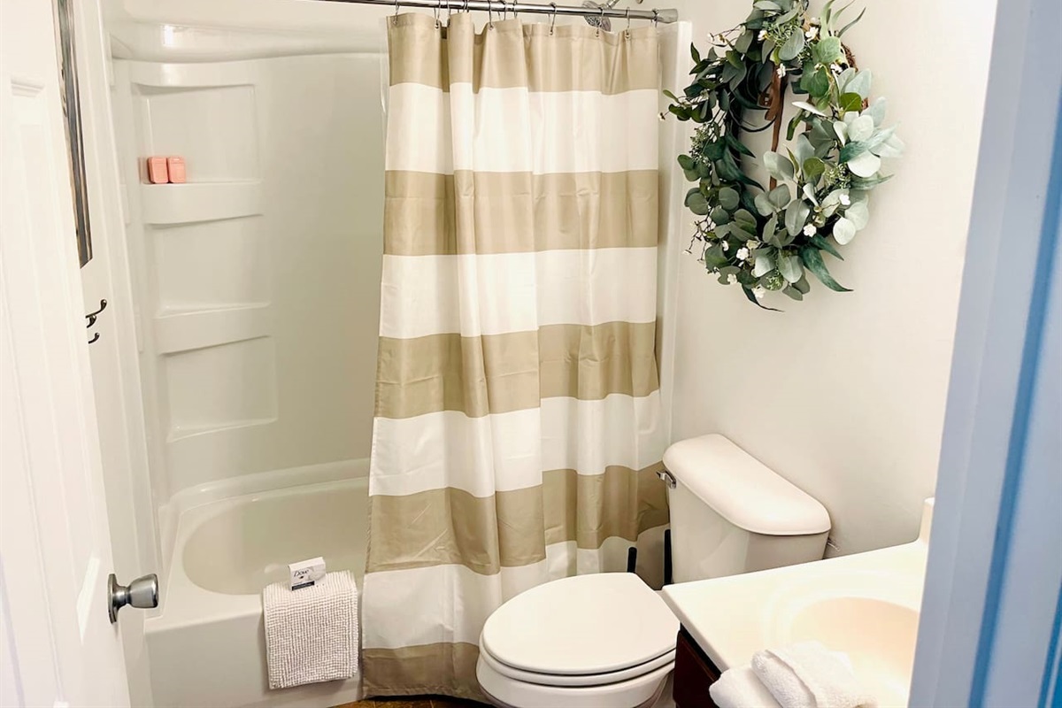 Full bathroom with tub and shower