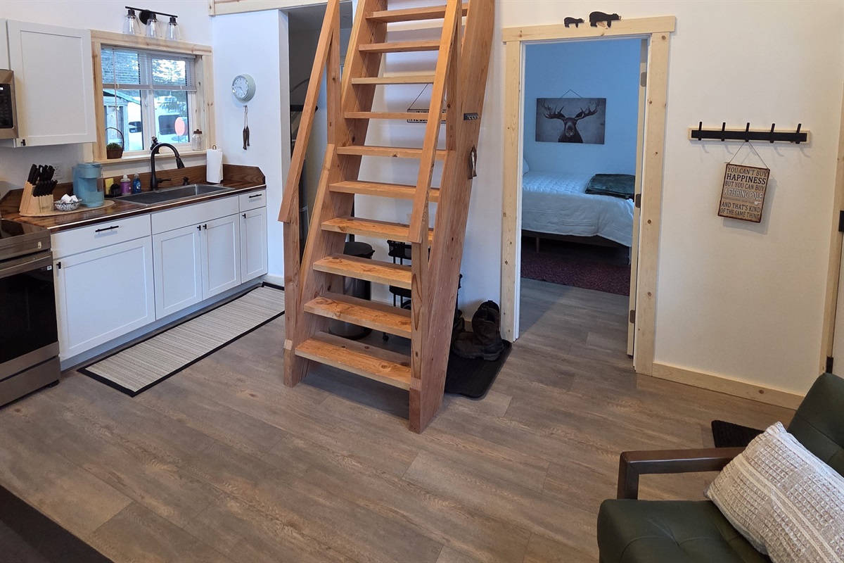 Main floor area.  Bedroom is to the right front.  Bathroom and laundry are to the right rear.  Ships Ladder access to the loft living area and additional sleeping area.