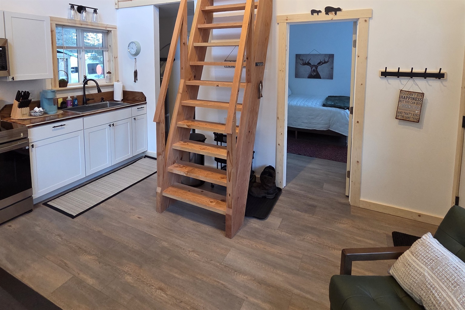 Main floor area.  Bedroom is to the right front.  Bathroom and laundry are to the right rear.  Ships Ladder access to the loft living area and additional sleeping area.