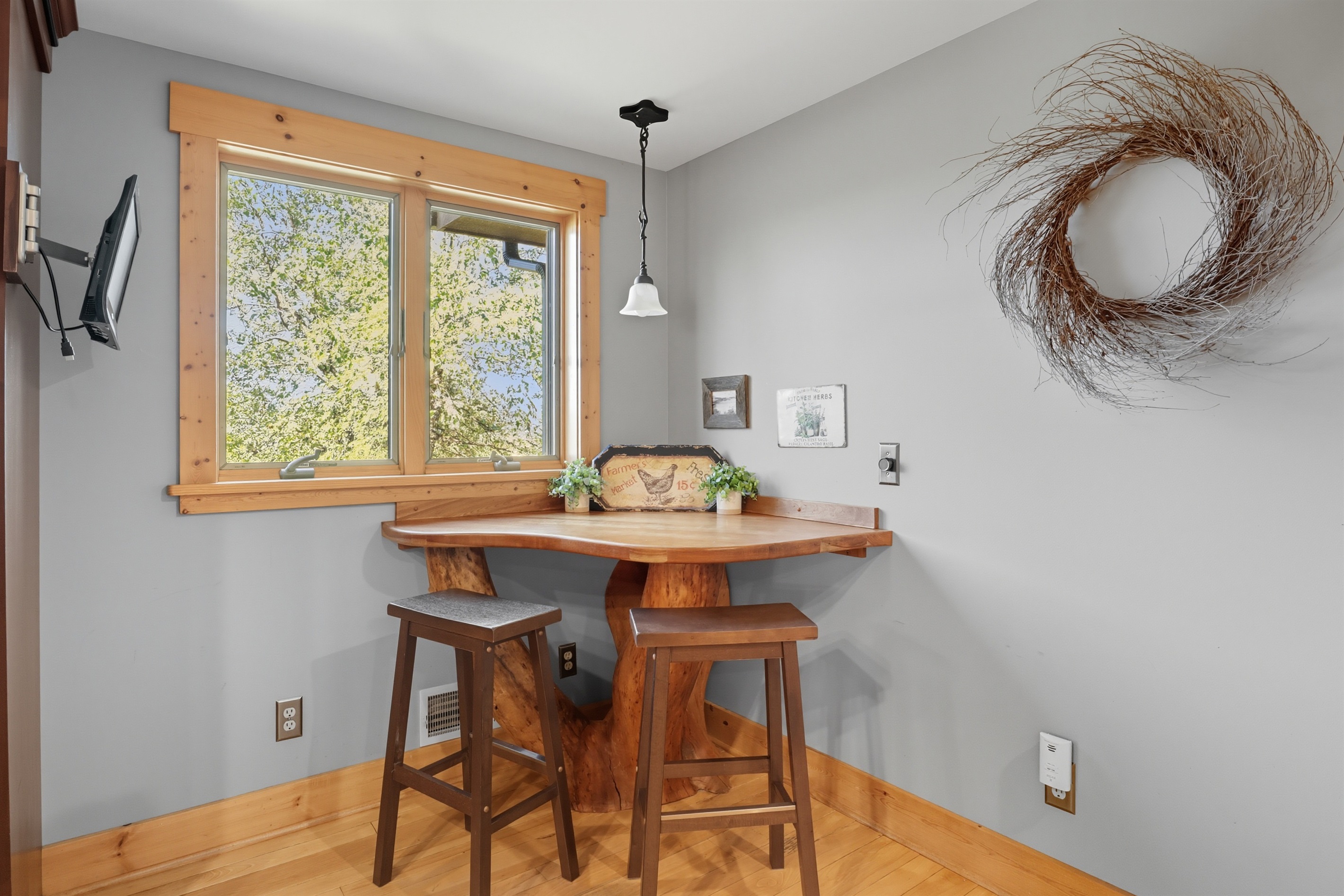 Quaint breakfast nook with window views of the outdoors.