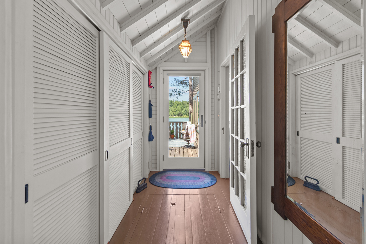 Follow the hallway toward the deck, where fresh air, peaceful lake views, and your next outdoor adventure are waiting.