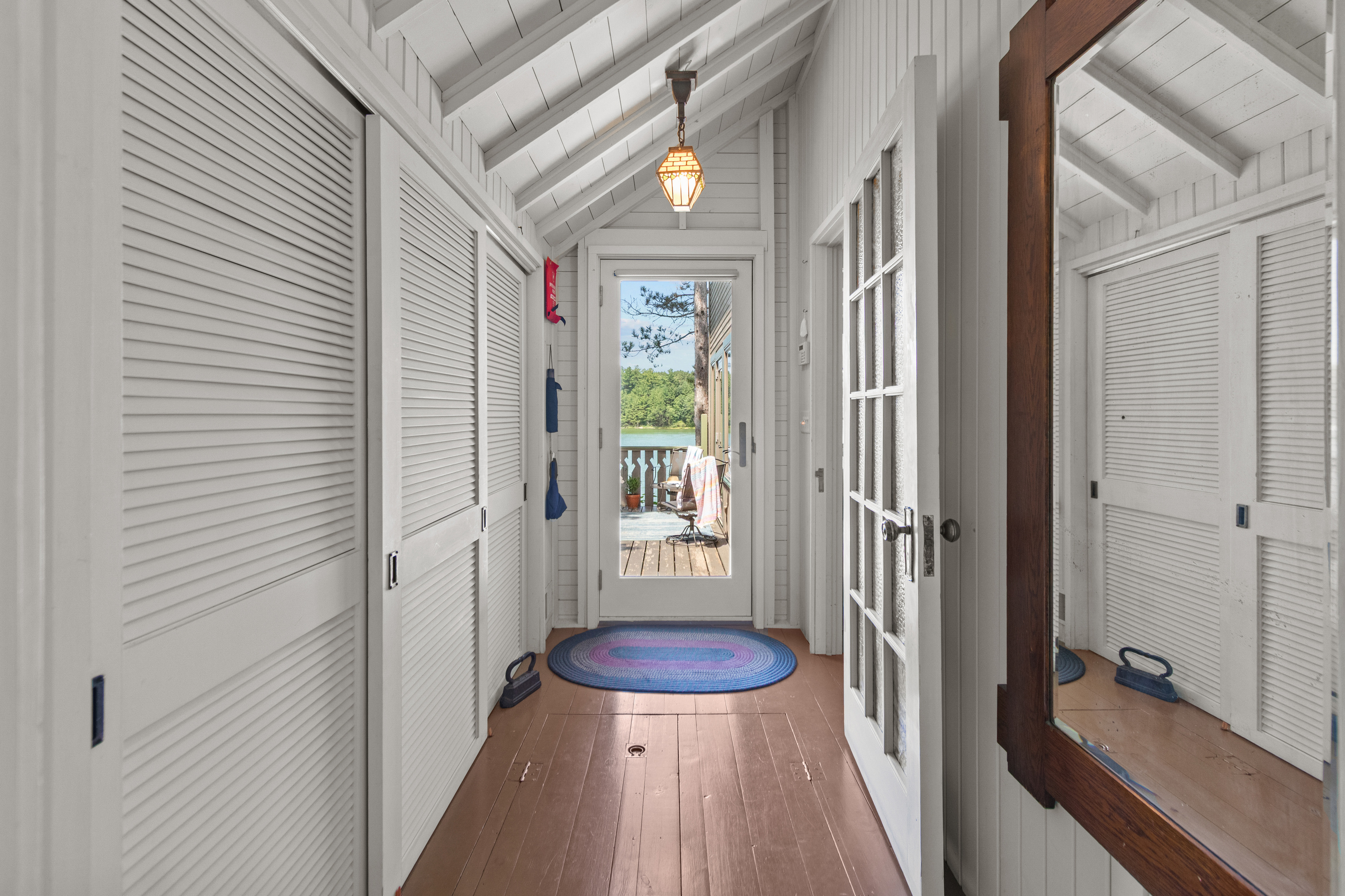 Follow the hallway toward the deck, where fresh air, peaceful lake views, and your next outdoor adventure are waiting.