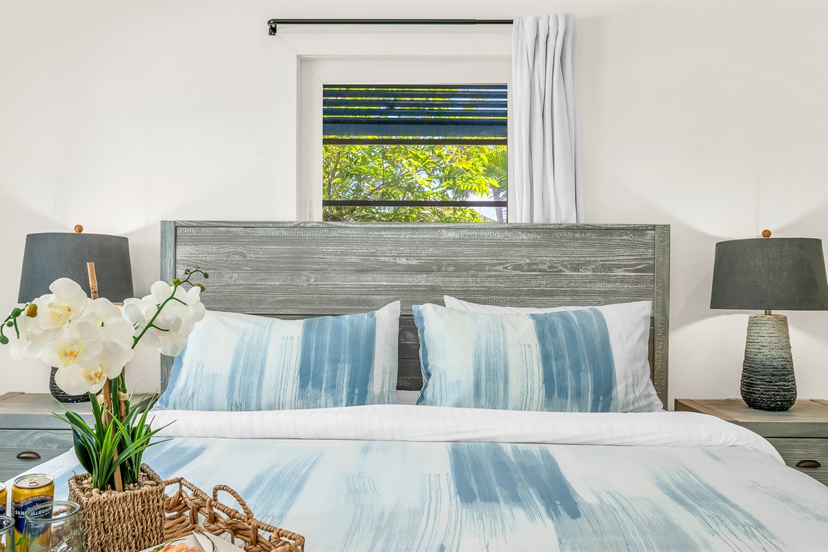 Primary Suite: King-size Tempur-Pedic Pro Adapt mattress, en-suite bath with dual-sink vanity. Pool views. 