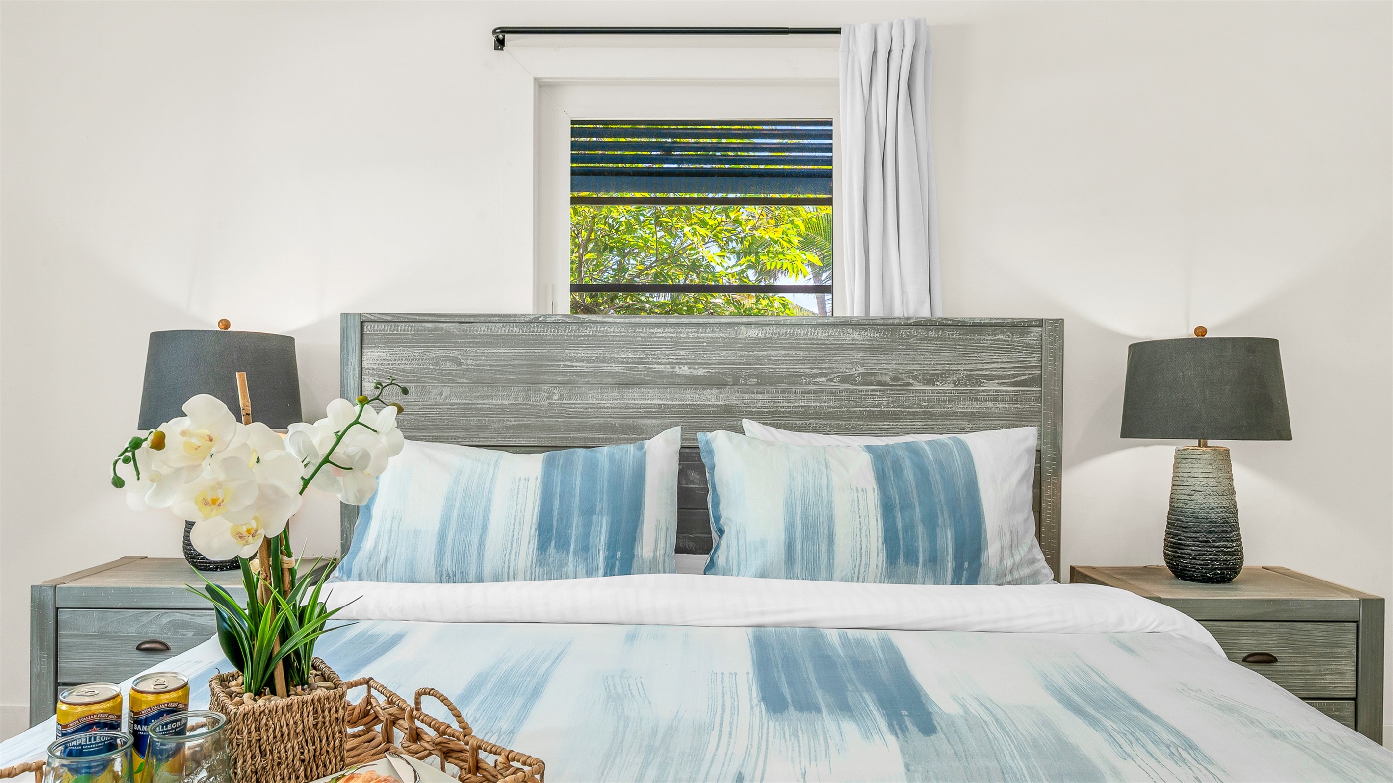 Primary Suite: King-size Tempur-Pedic Pro Adapt mattress, en-suite bath with dual-sink vanity. Pool views. 