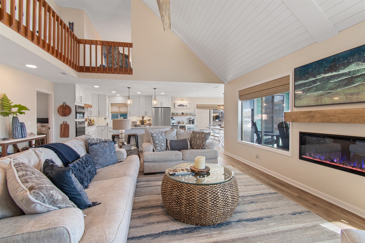 Open to kitchen and dining area