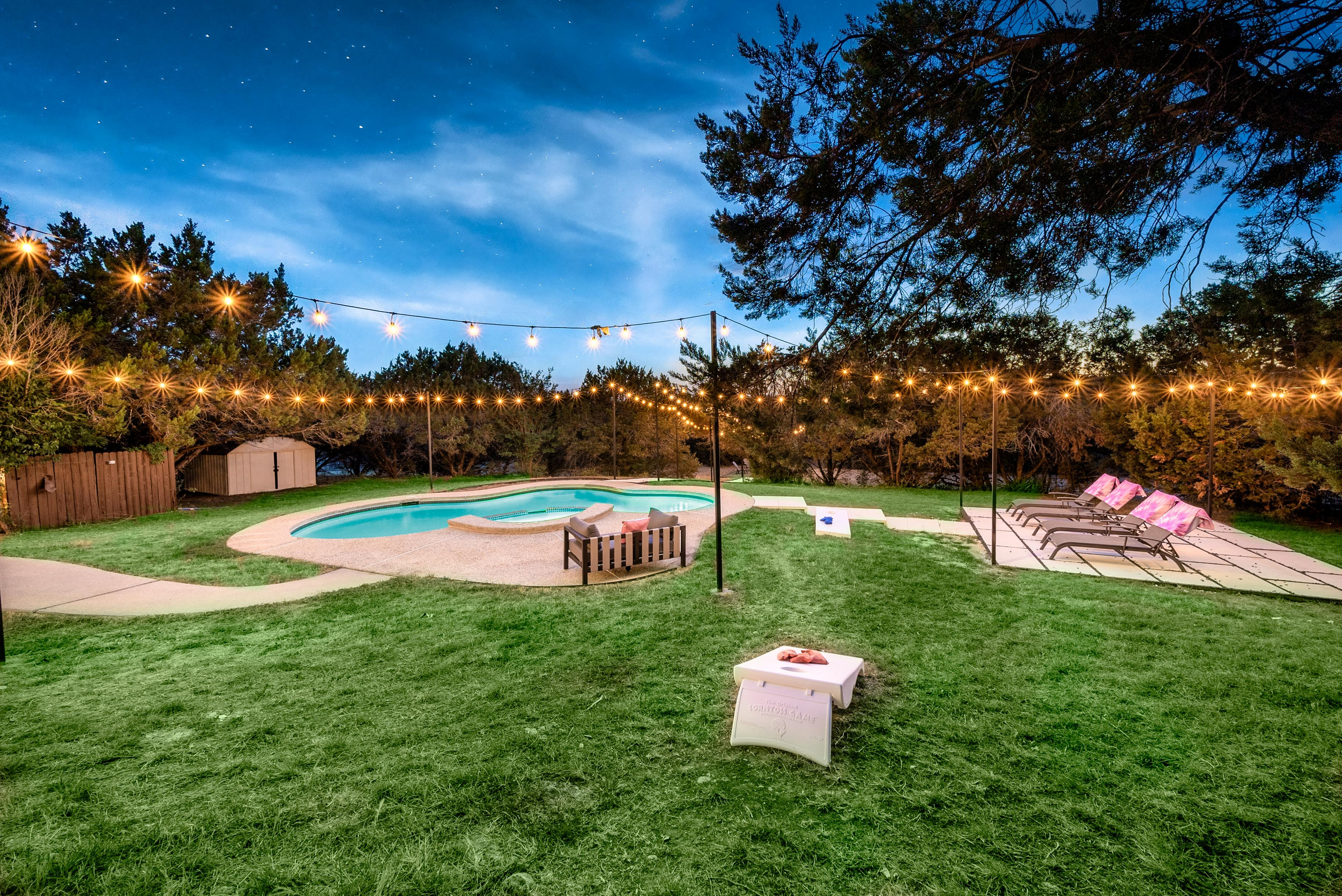 String lights and pool views set the perfect evening mood in the backyard.