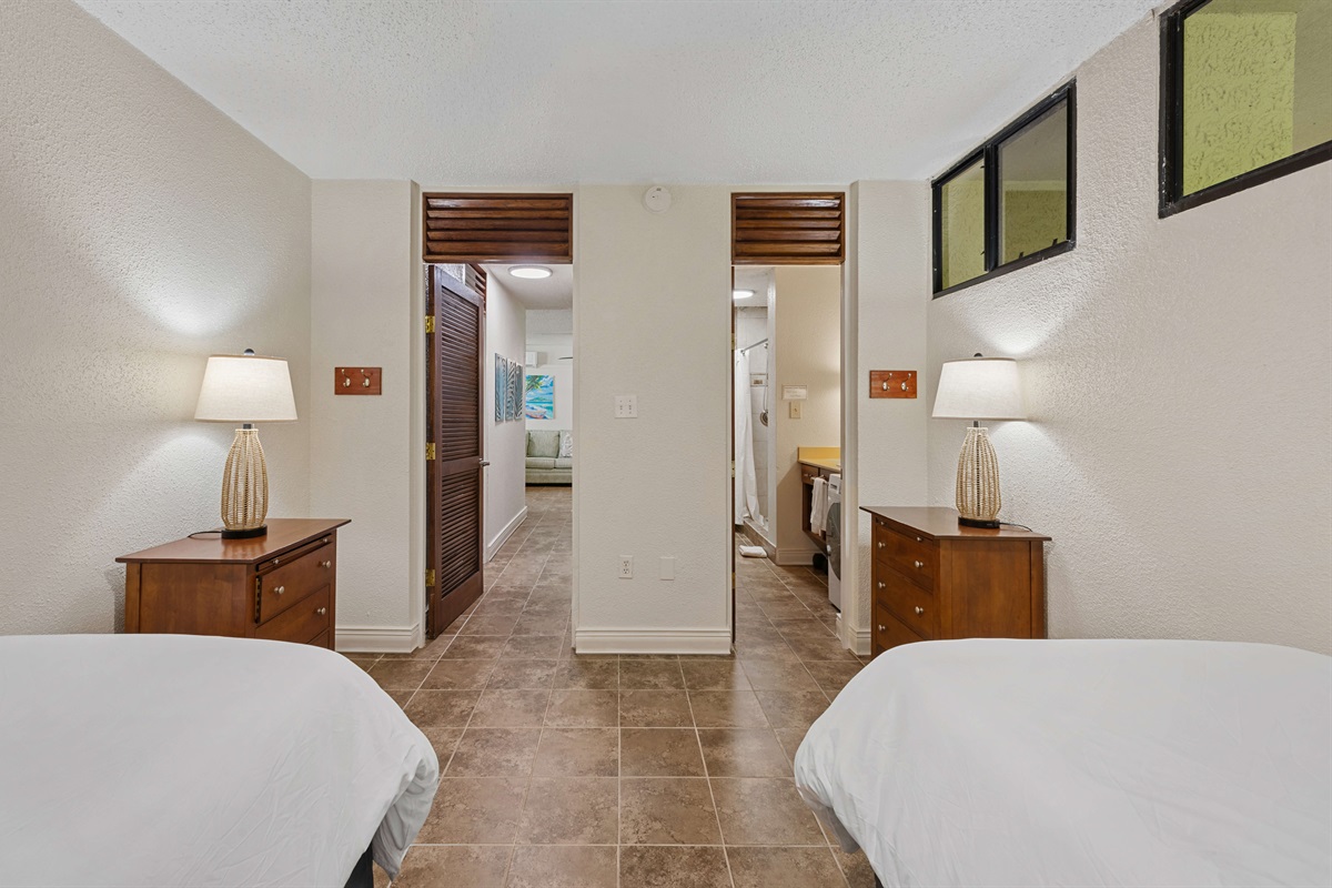 Guest bedroom at the end of the hallway. Can be turned into a king bed or left as two twins. Please specify after booking.