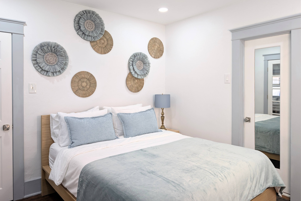 Wake up refreshed in a bright, thoughtfully designed bedroom with cozy bedding and a relaxing atmosphere that feels like home.