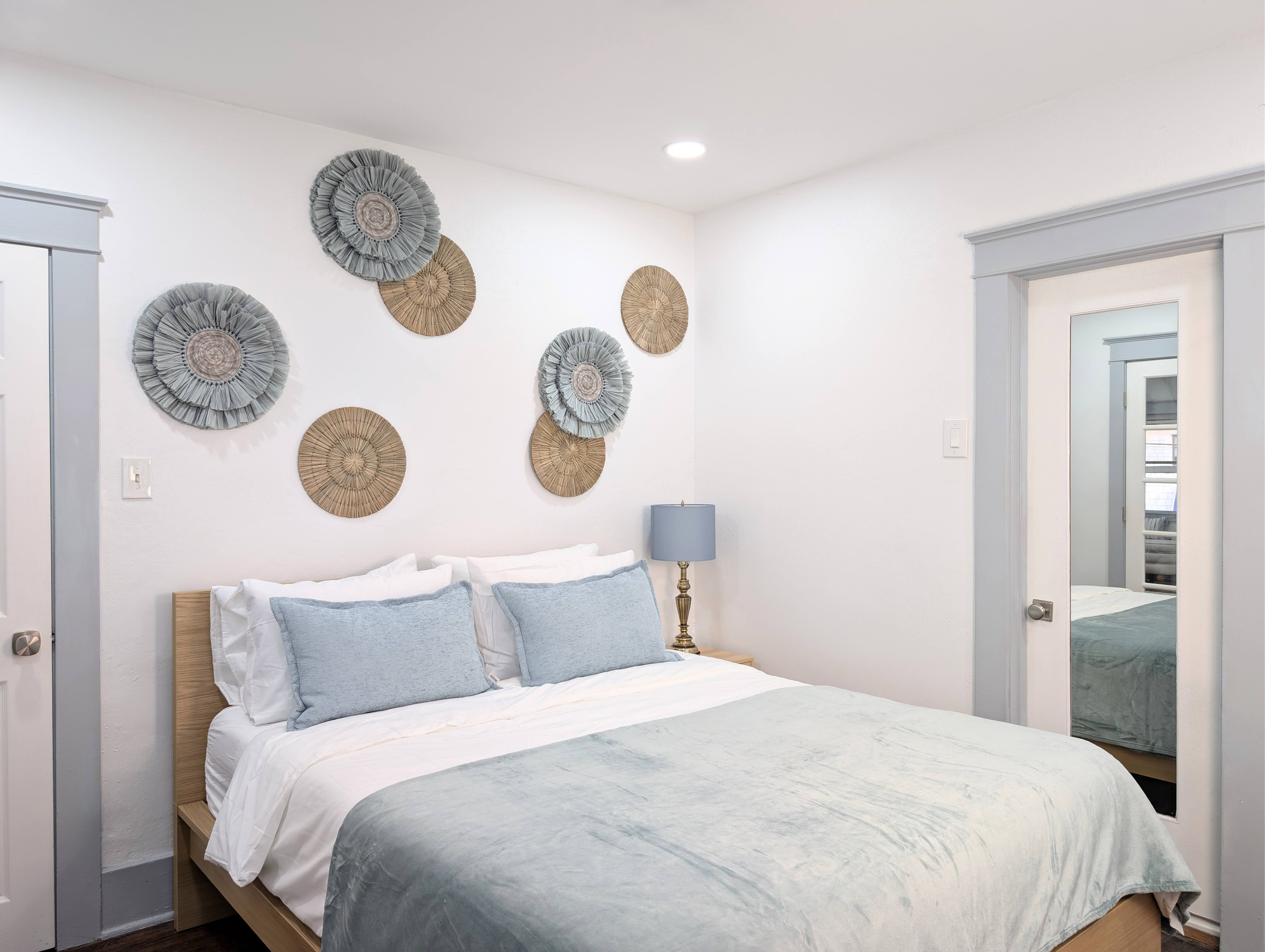 Wake up refreshed in a bright, thoughtfully designed bedroom with cozy bedding and a relaxing atmosphere that feels like home.