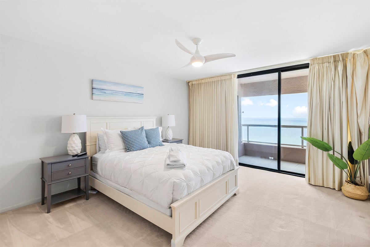 Primary bedroom, Queen size bed, ensuite bath, access to beachfront balcony