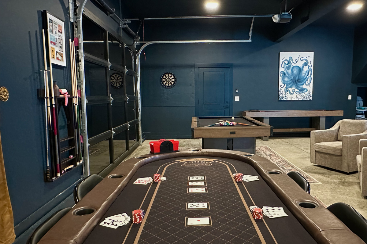 Shuffleboard, darts and poker under one roof, with a glass garage door to roll up on nice days — the Octopus Room is the reason people rebook.