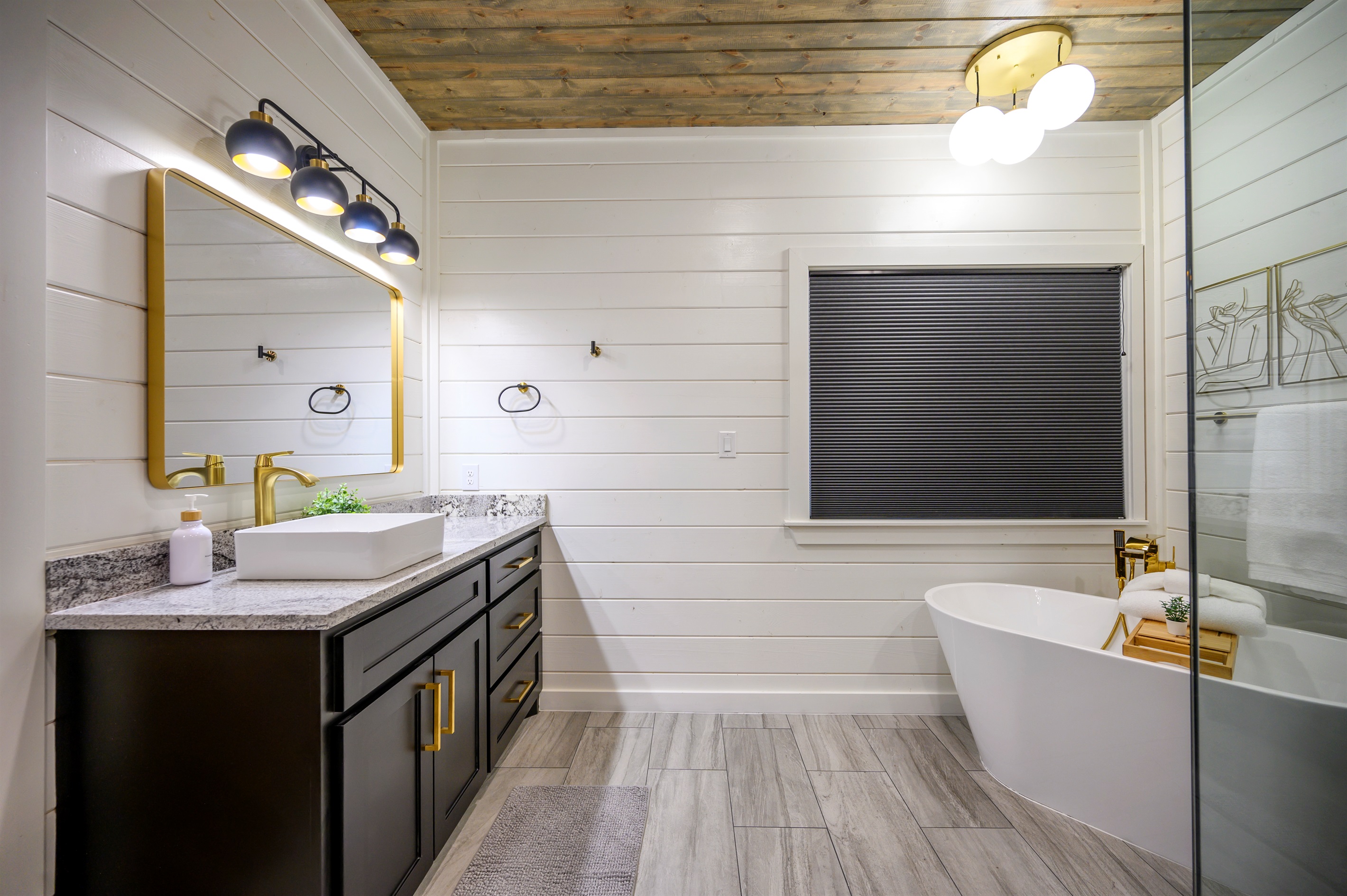 A complete bathroom setup featuring both tub and shower, providing flexibility and convenience throughout your stay
