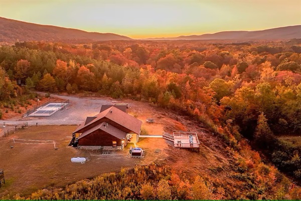 Fall aerial showcasing dramatic seasonal color across the valley.