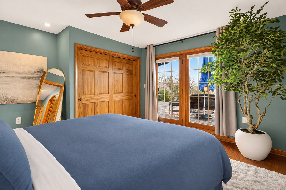 Bedroom 3 with glass doors opening to outdoor area