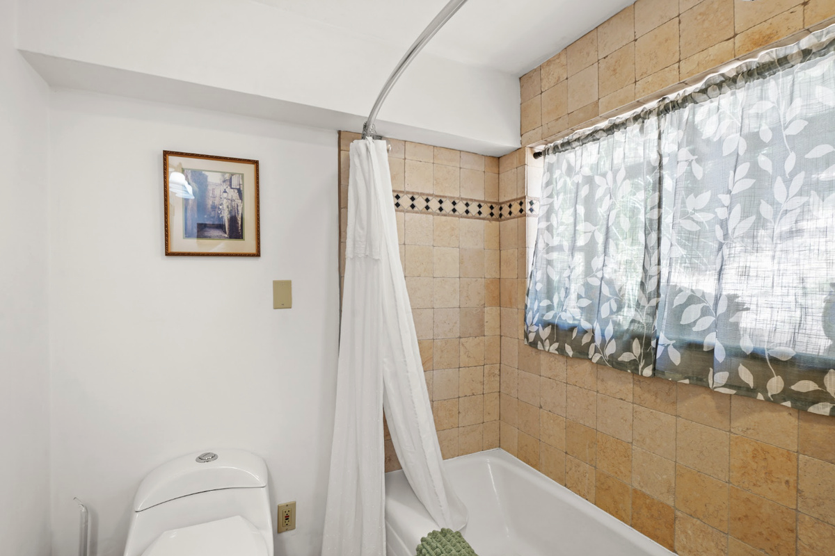 Full bathroom with tub and shower