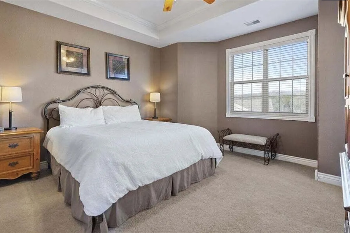 Relax in our comfortable master bedroom with a king-size bed and a private ensuite bathroom for added convenience.