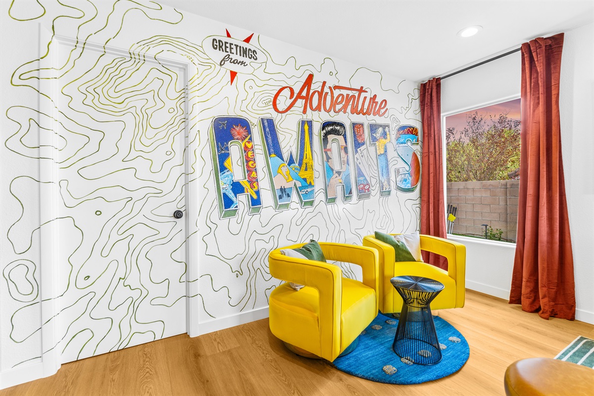 Our instaworthy postcard wall where you can take and send greeting photos back home.  Hand-drawn by a local artist.  Did you know??? The topographic lines on this wall are not random lines.  They are of the McCollough Range behind our home! Just WOW!