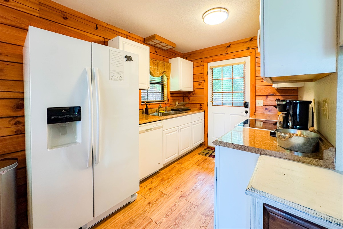 Small and efficient kitchen fully equipped with all basic cooking utensils