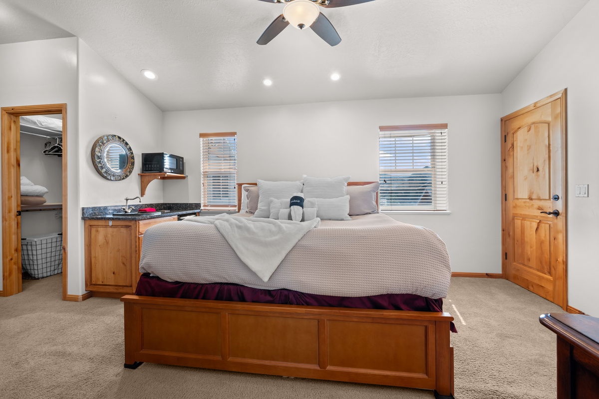 This bedroom has a large walk-in closet and a private sink with microwave.