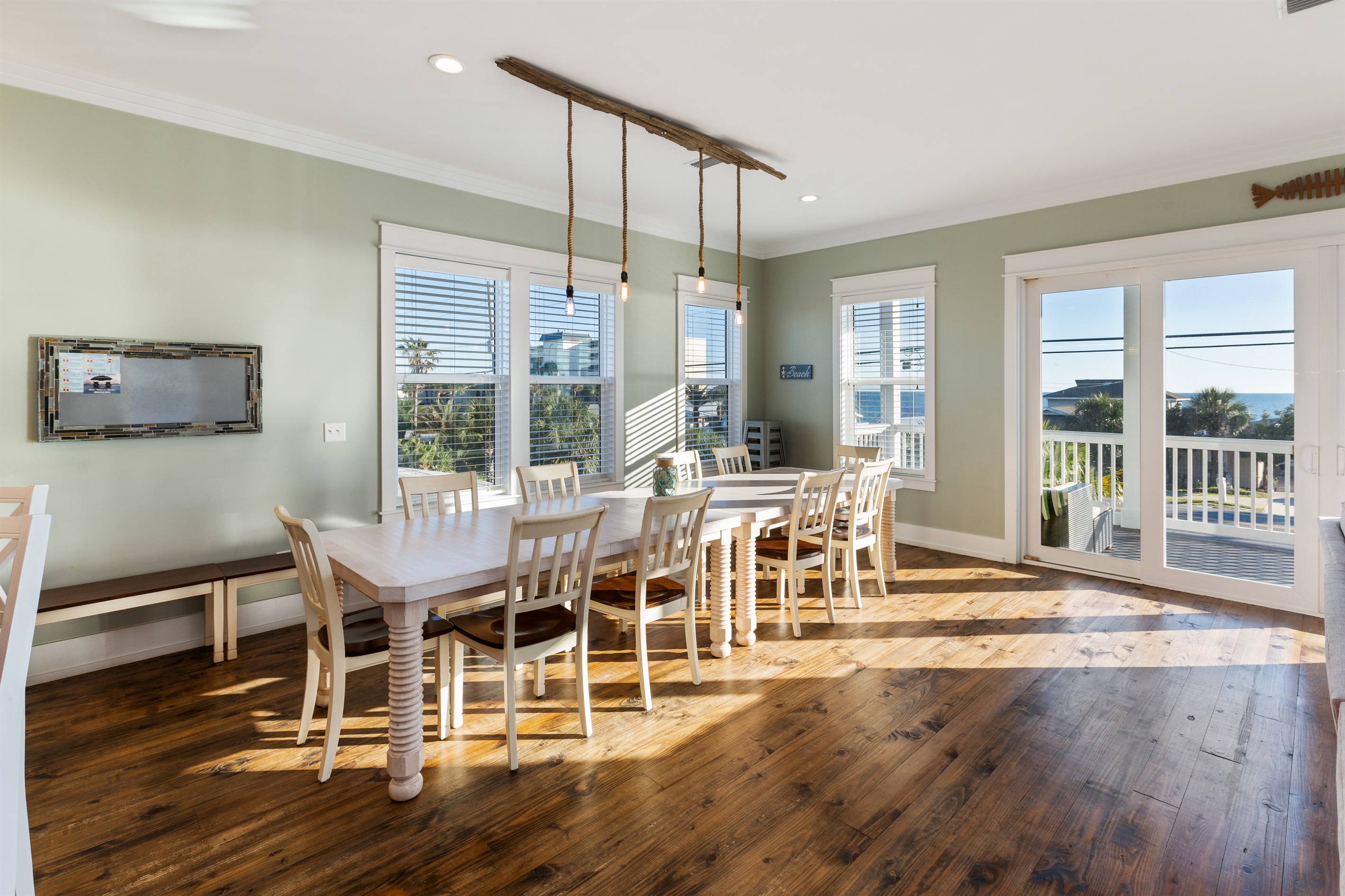 Well-lit common area on the second level includes a dining room table on the 2nd floor that seats 14. Additional seating for 7 at the island. Hotel quality furnishings on the deck offer additional space for everyone to gather and be together.