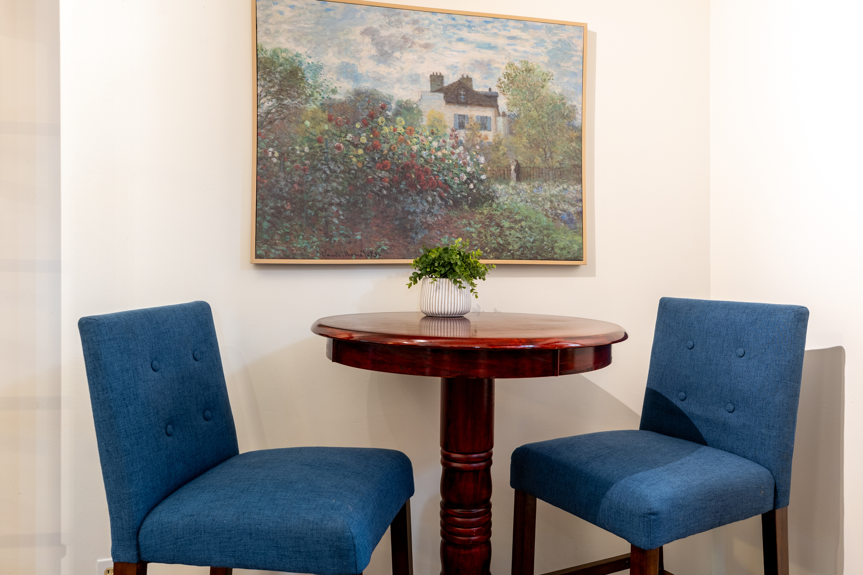There is a high-top table in the kitchen, with additional chairs located in the laundry room.
