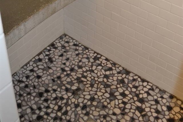 Shower floor in main level bathroom