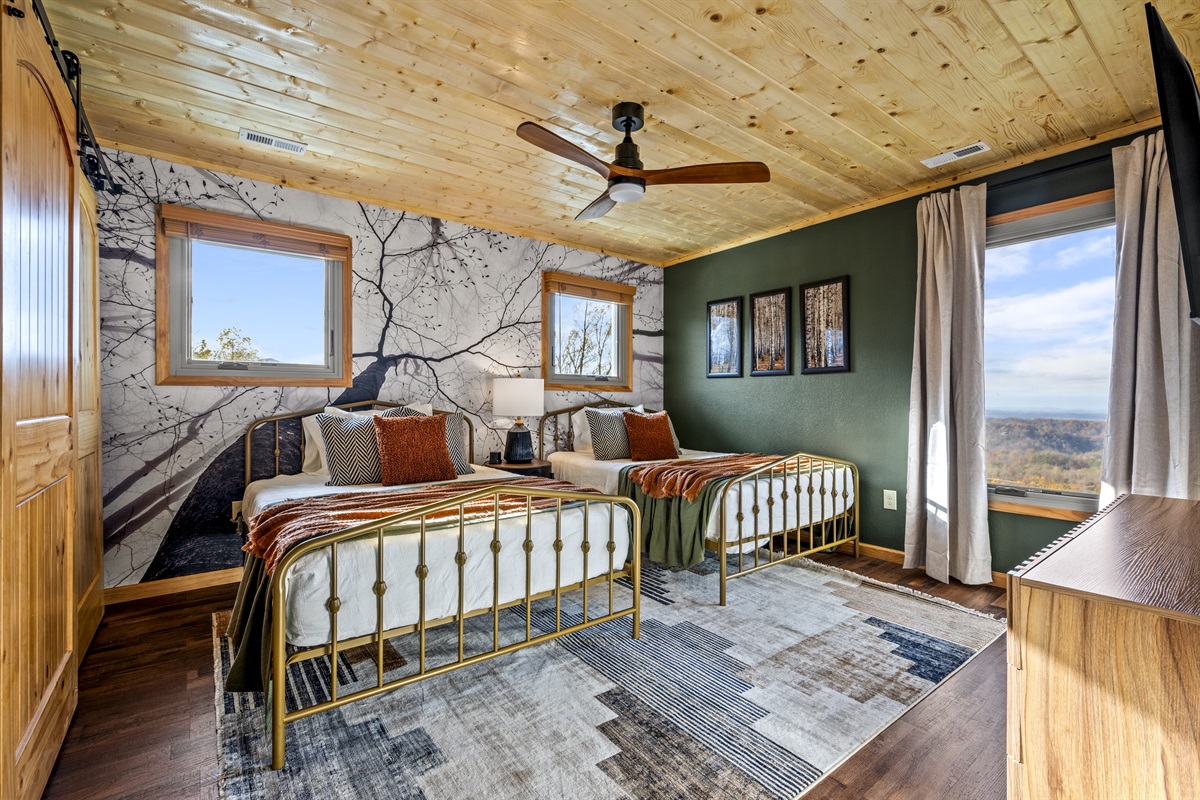 2nd floor: Rest comfortably in the bedroom featuring two full beds with soft cotton linens for a cozy retreat