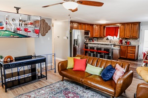 Make our living room the center of family moments, offering plush couches and a TV for delightful movie nights and bonding.