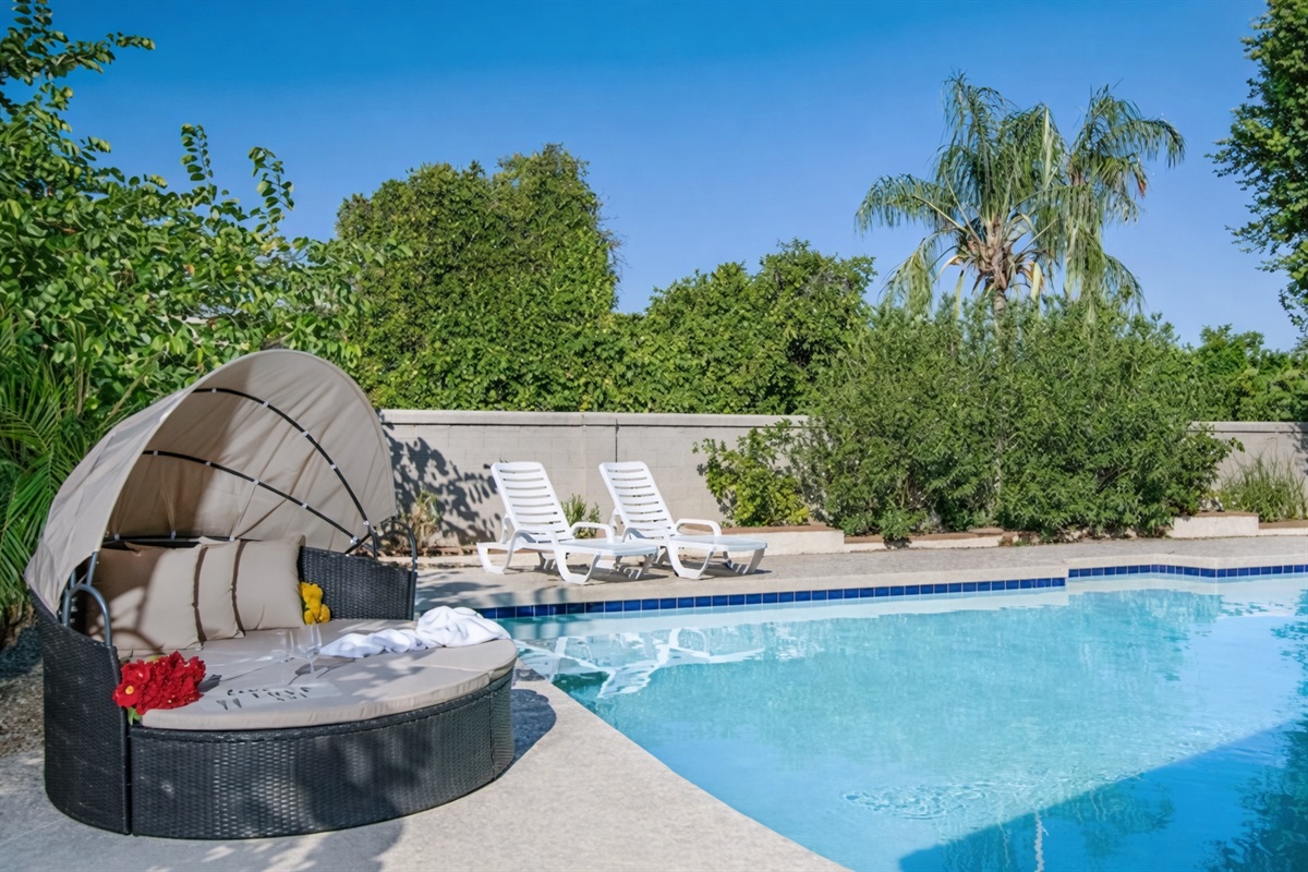 Soak up the sun or slip into the heated pool for a relaxing retreat surrounded by lush privacy and resort-style comfort.