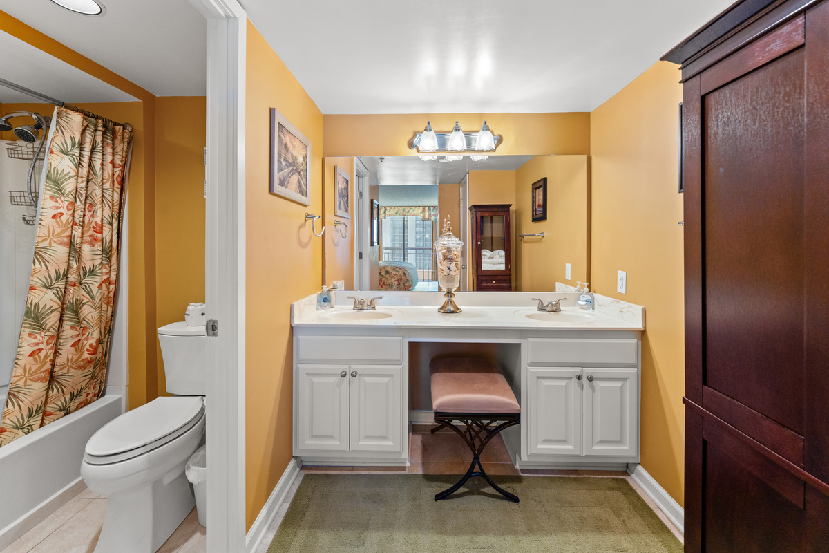 Main Bathroom with tub/shower, double sinks and makeup chair