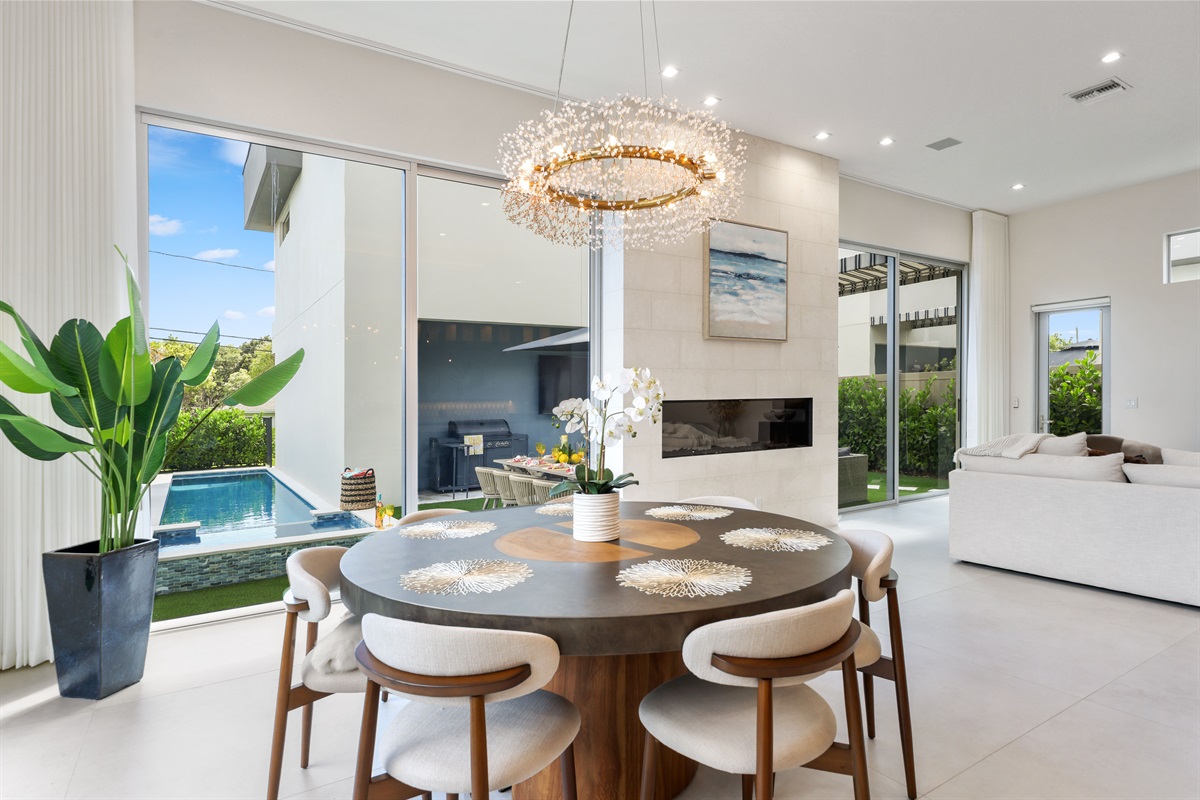 Spacious dining area – enjoy meals with pool views and seating for eight.