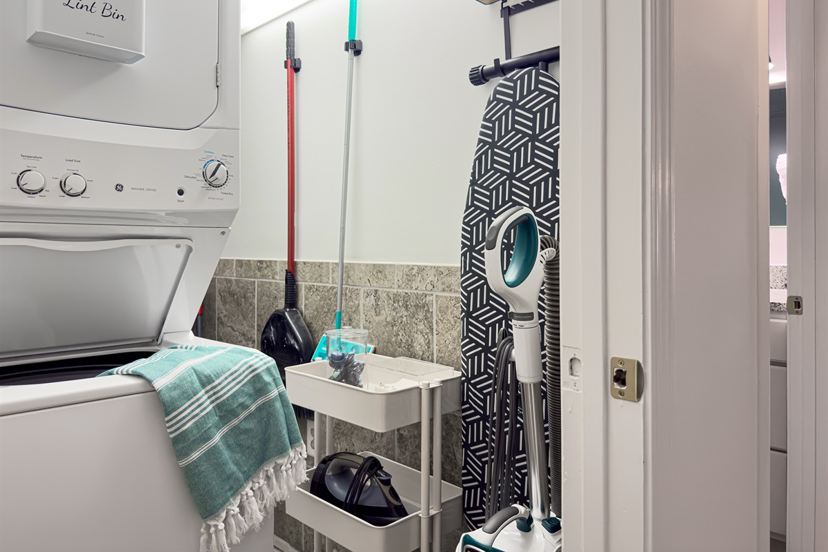 Fully loaded laundry room in-suite offers everything you'll need to ensure proper laundry is attainable! Laundry pods, dryer sheets, cleaning supplies, iron and ironing board are at the ready.