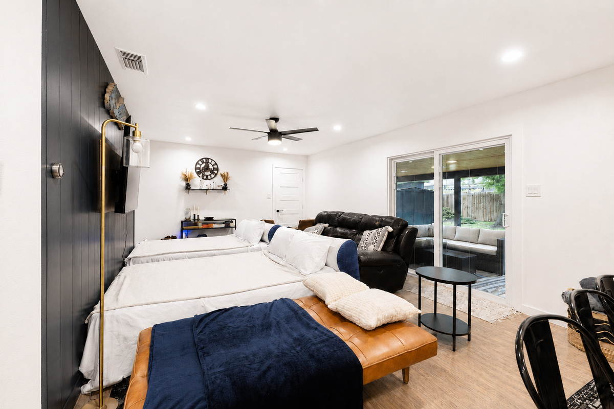 Relax in this bright space with ample seating and views of the outdoor retreat!