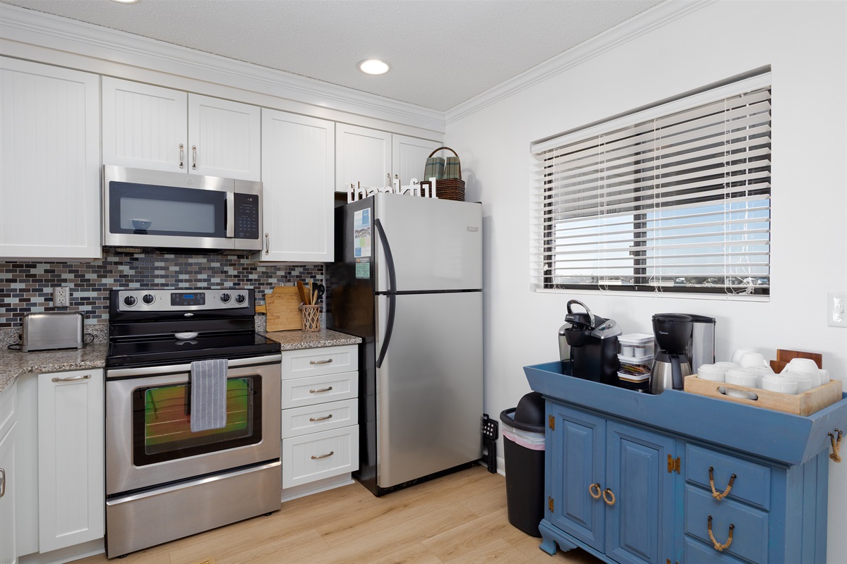 The kitchen features a coffee bar station