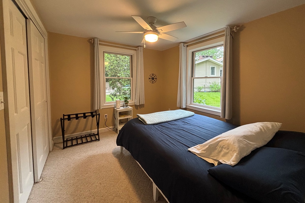 Queen bedroom in guest house with pool and water views