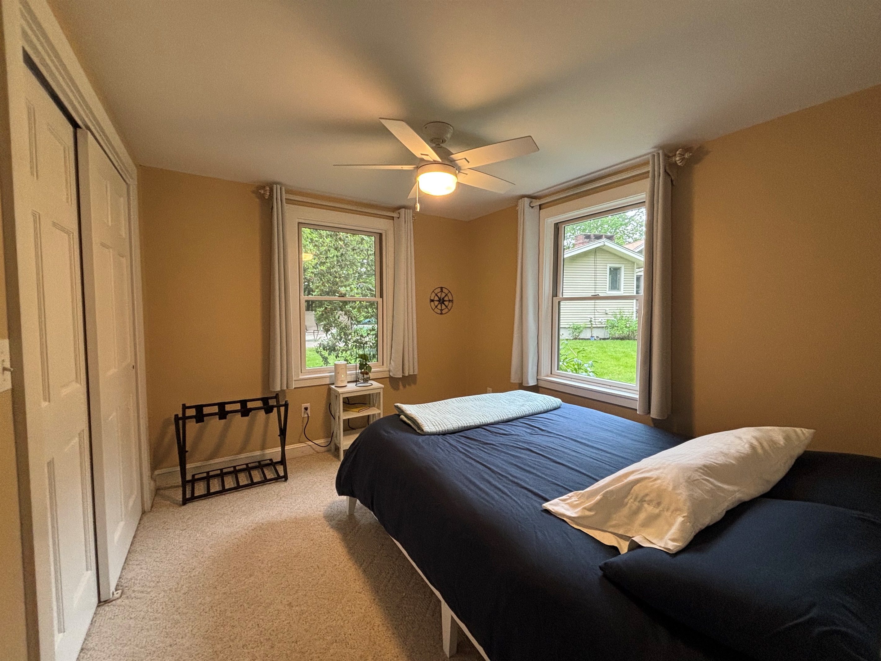 Queen bedroom in guest house with pool and water views