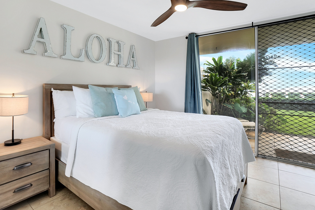 Second bedroom with plush queen bed and ocean view