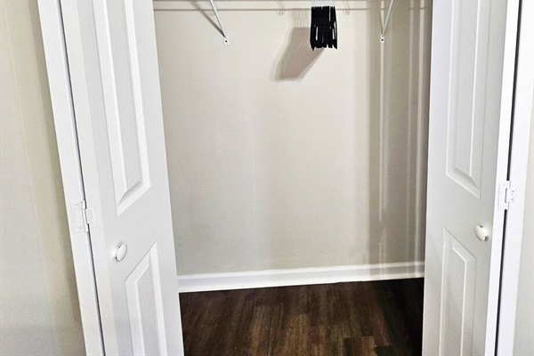 The closet has plenty of space for storage. You will find an extra pillow, blanket, set of linen, and hangers in the closet.