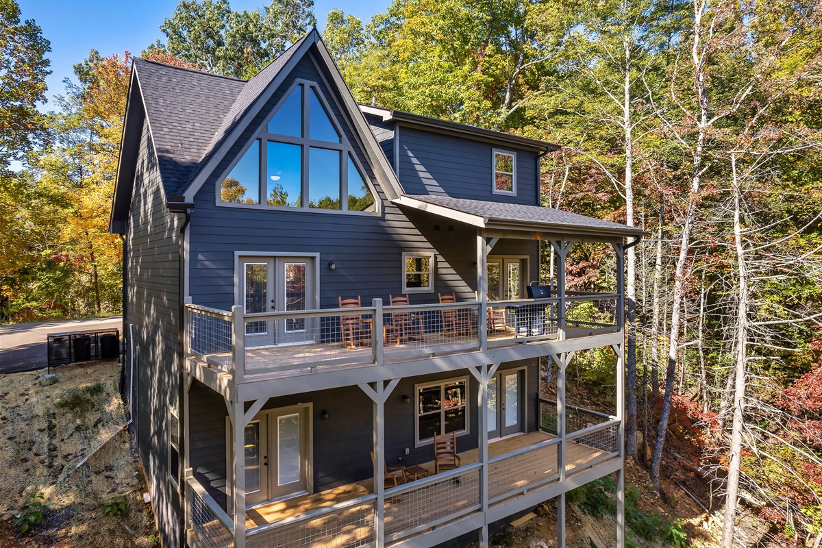 Two spacious covered decks overlook the cabin’s quiet mountain setting.