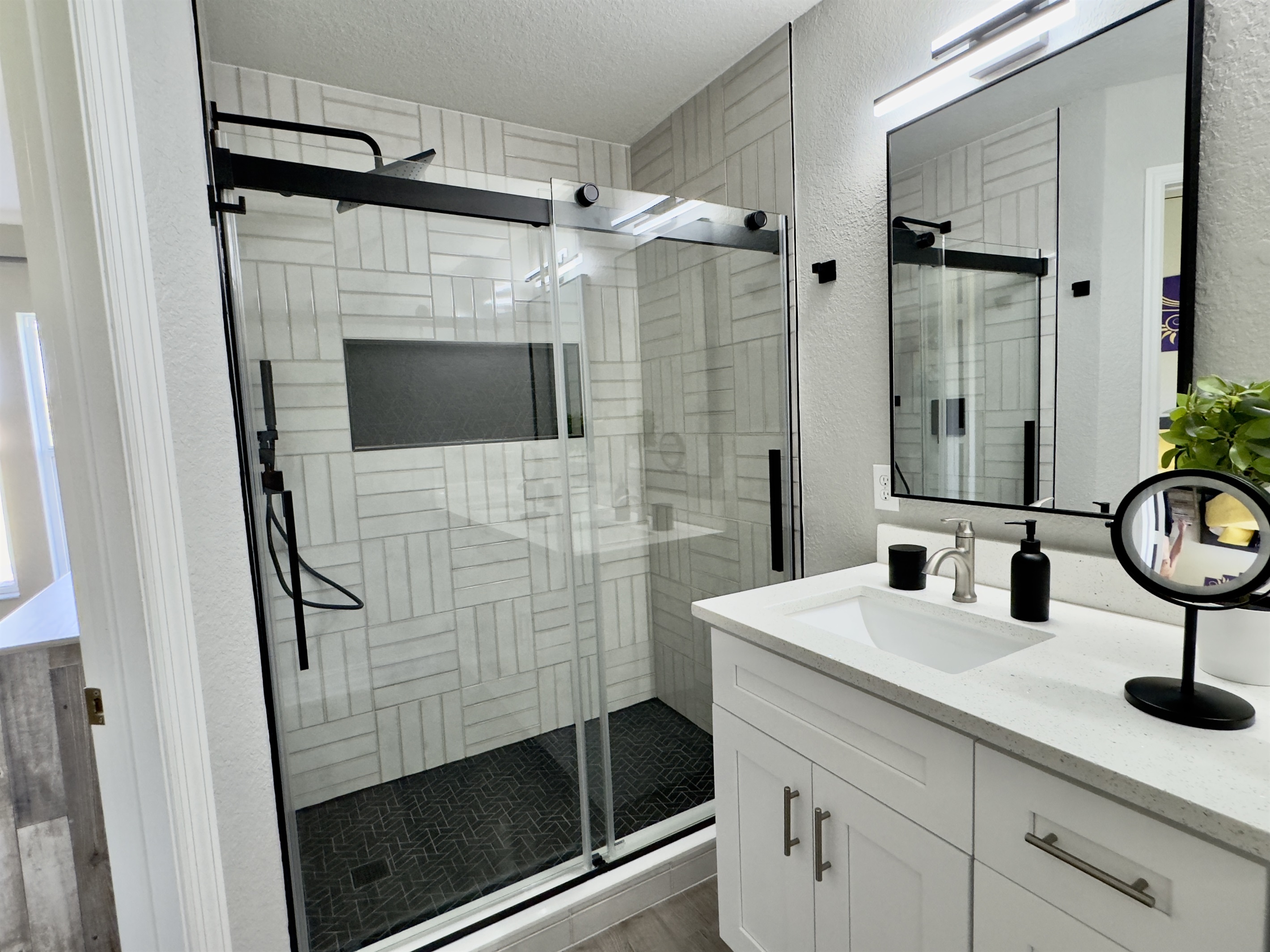 Beauty and the Beast ensuite with custom tile, double sinks, and rain shower