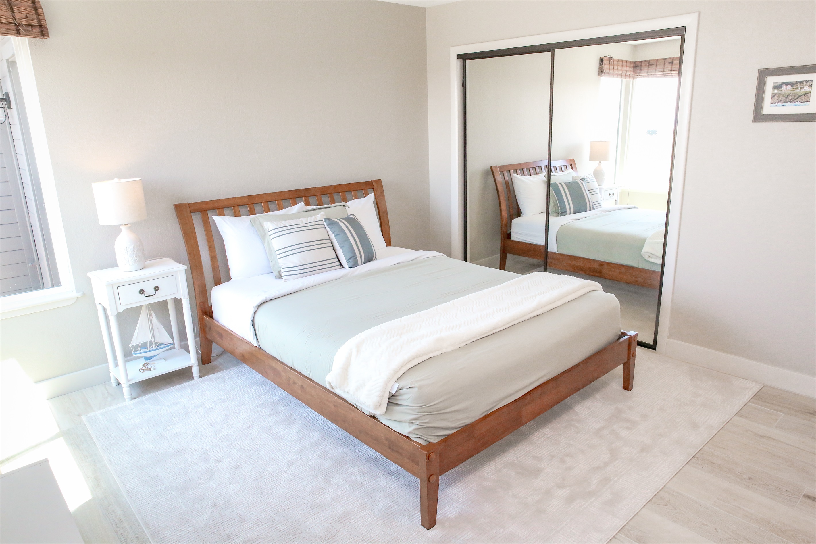 Green sea ensuite with queen bed